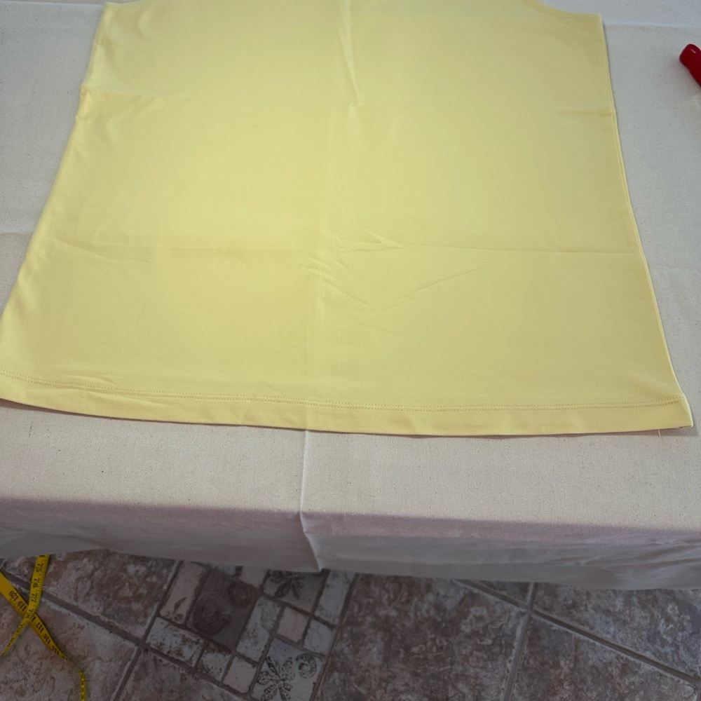 Set up two sleeveless tanks from Chico stores one blue one yellow